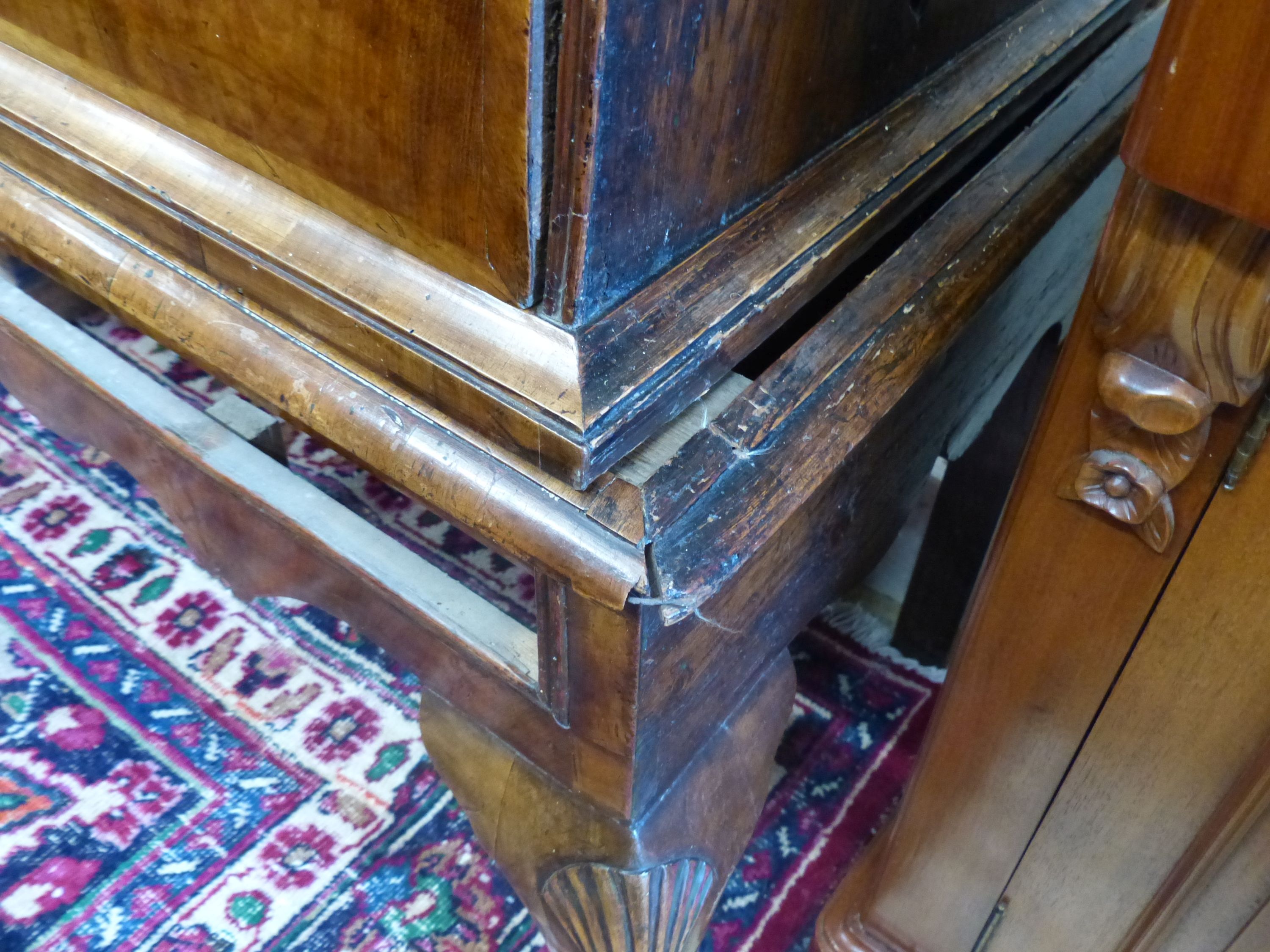 An early 18th century walnut and pine sided chest on stand, width 101cm, depth 58cm, height 138cm